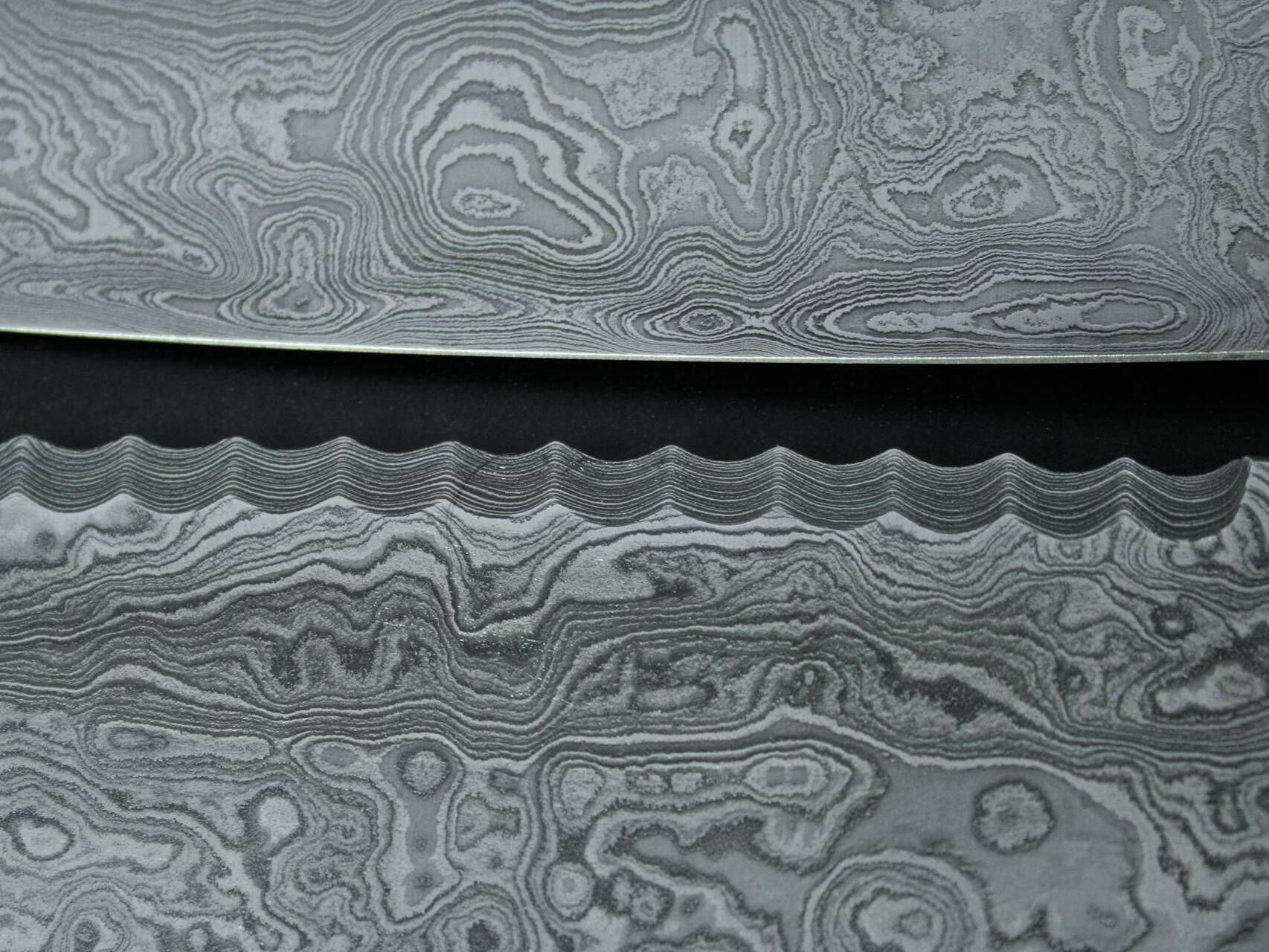 Messer Solingen, Güde Messer, Kochmesser Solingen, Messerset, wetzstahl, solinger messer Nahaufnahme vom Brotmesser Damaststahl mit einzigartigem Güde-Wellenschliff